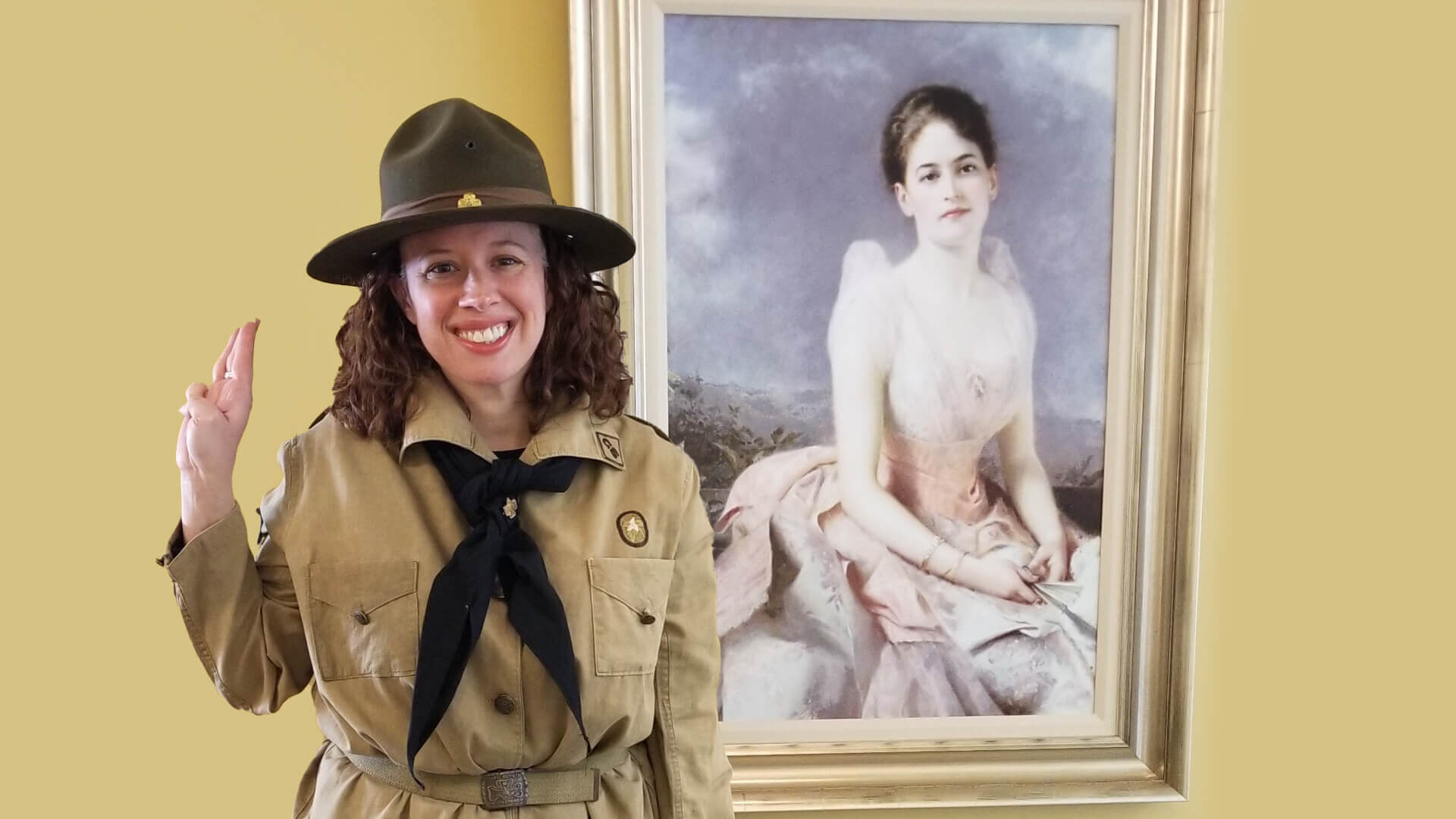 amy dosik posing in front of portrait